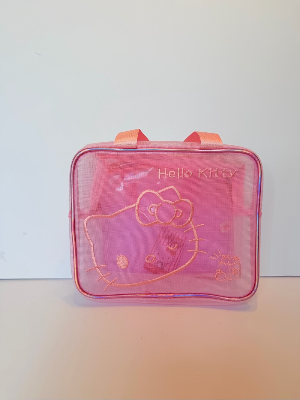 Hello kitty mesh bag new with tags good for make up, snacks, or travel